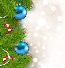 Image showing Christmas composition with fir branches, glass balls and sweet c