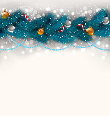 Image showing Christmas decoration with fir branches, glass balls and sweet ca