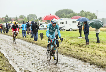 Image showing The Cyclist Michele Scarponi on a Cobbled Road - Tour de France 