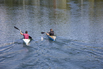 Image showing Two men in a canoes