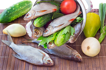 Image showing Fish and components for her preparation: vegetables, spices, par