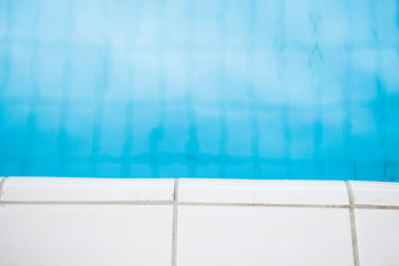 Image showing Edge of swimming pool with white tiles