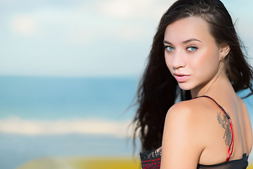 Image showing Portrait of beautiful young brunette with tattoo