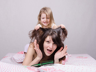 Image showing My daughter pulls her hair mom