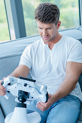 Image showing Middle Age Caucasian Man Playing His Cool Gadget