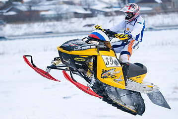 Image showing Sport snowmobile jump on track