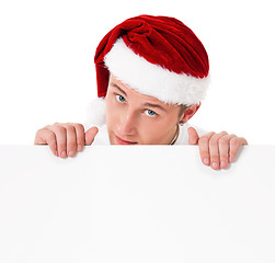 Image showing Young man in Santa hat