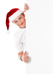 Image showing Young man in Santa hat