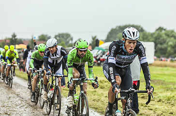 Image showing The Peloton on a Cobbled Road- Tour de France 2014