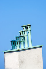 Image showing chimneys on a roof with a blue sky