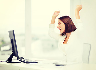 Image showing businesswoman with computer in office