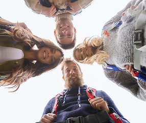 Image showing group of smiling friends with backpacks hiking