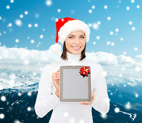 Image showing woman in santa helper hat with tablet pc