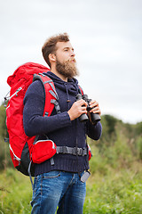 Image showing man with backpack and binocular outdoors