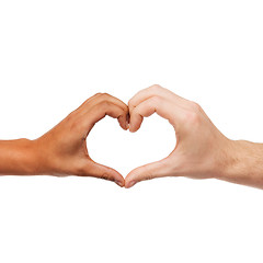 Image showing woman and man hands showing heart shape