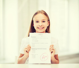 Image showing girl with test and grade at school