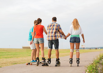 Image showing group of teenagers with roller-skates