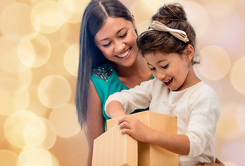 Image showing happy mother and child girl with gift box