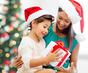 Image showing happy mother and child girl with gift box