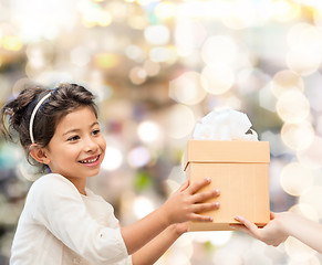 Image showing smiling little girl with gift box