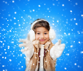 Image showing smiling little girl in winter clothes