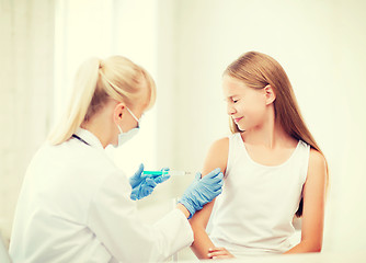 Image showing doctor doing vaccine to child in hospital