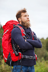 Image showing man with backpack and binocular outdoors