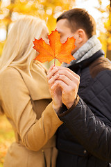 Image showing close up of couple kissing in autumn park