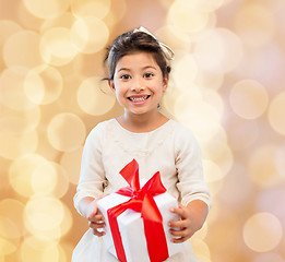 Image showing smiling little girl with gift box