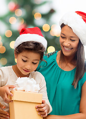 Image showing happy mother and child girl with gift box