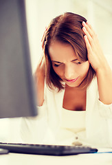 Image showing stressed woman with computer