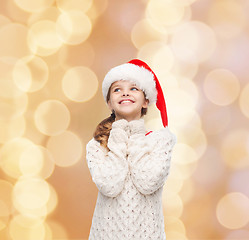 Image showing dreaming girl in santa helper hat