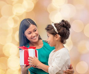 Image showing happy mother and child girl with gift box