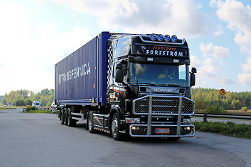 Image showing Black Scania Truck Hauls Container