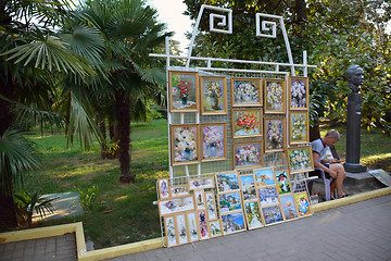 Image showing The artist selling pictures in the park