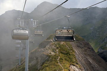 Image showing Chairlifts in a cloud