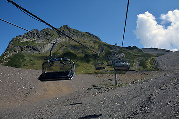 Image showing Empty chairlifts moving in the mountains