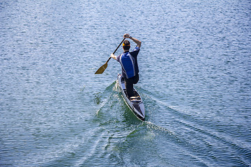 Image showing Man rowing in a canoe 