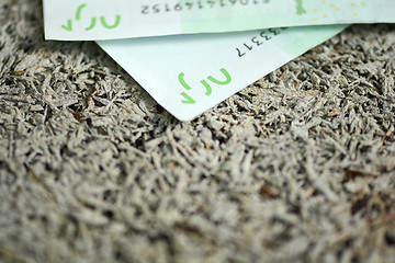 Image showing Close-up of  100 Euro banknotes isolated on white background.