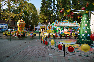 Image showing Children on roundabouts in Riviera park