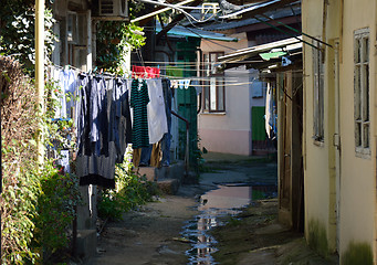 Image showing Small backyard with picturesque houses