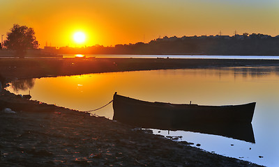 Image showing  fishing boat with sunrise in the background