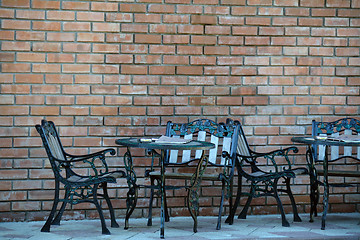 Image showing Two metal decorated cafe tables