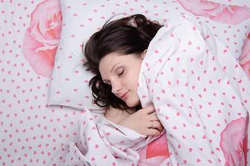 Image showing Girl covered with a blanket in bed