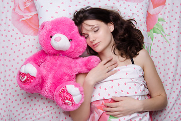 Image showing Girl sleeping with teddy bear