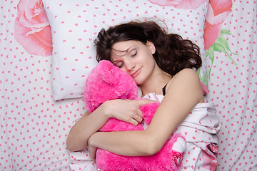 Image showing The girl put her in a dream bear