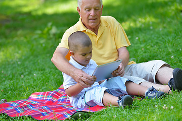 Image showing happy grandfather and child in park