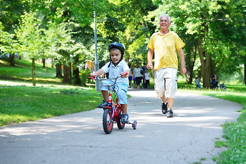 Image showing happy grandfather and child in park