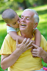 Image showing happy grandfather and child in park