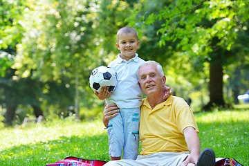 Image showing happy grandfather and child in park